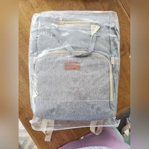 Diaper bag backpack with built in changing pad